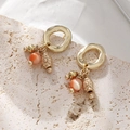 Luxe kattenoog steen oorbellen met vintage gouden holle metalen bollen design - Vintage Goud - Oranje Roze