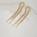 Elegant 14K gold plated tassel earrings with chain drop and beaded design on white background - U-Shape Tassel Style / Gold