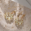 Elegante Goldohrringe mit facettierten gelben Kristallperlen und weißen Zirkonia-Details - AB Bunter kreisförmiger Flachperlenstil