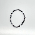 Detailed view of elastic evil eye beaded bracelet with blue glass resin charms - Black