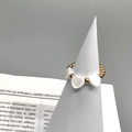Detail of 18K gold beaded elastic ring featuring three heart-shaped shell charms on a stand - Adult / Triple Heart Shell Style (DR009)