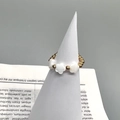 Detail of 18K gold stainless steel beaded ring featuring three white shell flowers - Triple Flower Shell Style (DR009)