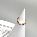 Detail of 18K gold beaded stainless steel ring with white shell star charm on a stand - Single Star Shell Style (DR009)