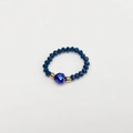 Detailed macro view of elastic beaded ring featuring heart-shaped blue iridescent gem - Child-Inner Diameter 13-14mm / Dark Blue-Gold