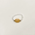 Macro view of elastic beaded ring featuring central yellow faceted olive bead - Child-Inner Diameter 13-14mm / Yellow-Gold