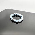 Macro detail of elastic Evil Eye beaded ring with blue nazar beads and silver metal accent - Blue White-Steel Accessories / One Size 17mm