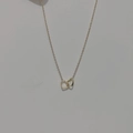 Detail of interlocking hollow heart-shaped pendants on a delicate gold chain necklace - Double Heart Style (WN041)