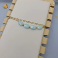 Double-layered gold titanium steel bracelet featuring star-shaped beads and blue crystals - Double Layer Blue Beads Style (DB037)
