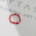 Detailed shot of red faceted crystal beads and silver steel balls on a stretch ring - Inner Diameter 17-18mm / Steel/Red Square Crystal
