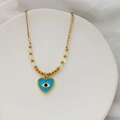 Détail du pendentif cœur œil bleu avec émail, perles dorées et pierre de zircon cubique - Bleu clair