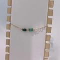 Detail of paperclip chain bracelet with square turquoise stones and gold beads - Gold-Green Spot