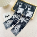 Detailed view of black and white tie-dye cooling arm sleeves for sun protection - 13D Tie Dye Black