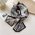 Long silk scarf twilly with zebra and floral prints in elegant rolled display - Windmill Zebra Pattern
