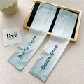 Detail of gradient mint green ice silk sun protection sleeves with logo branding - One Size / Gradient Green