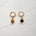 Close-up of vintage teardrop tiger eye stone charms on polished 18k gold steel hoop earrings - Natural Tiger Eye Teardrop-Gold