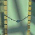 Detail of double-layer titanium bracelet featuring a blue natural stone and silver beads - White Blue Dotted Oval Steel