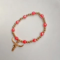Detail of bohemian gold beads and red crystal beads with a bull skull pendant charm - Red