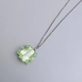 Detail of light green irregularly shaped glass pendant on a silver stainless steel chain - Steel-Green