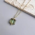 Detail of square green glass pendant on gold 18K plated stainless steel chain - Gold-Green
