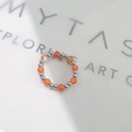 Elastic beaded ring featuring translucent orange cat-eye stones and silver steel beads - Inner Diameter 17-18mm / Steel/Orange Cat's Eye