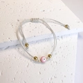 Bracciale Evil Eye bianco intrecciato a mano con ciondolo rosa e perline dorate - Rosa Bianco