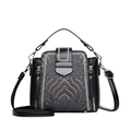 Classic black leather crossbody bag featuring elegant gold Chinese embroidery and top handle - Black