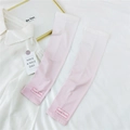 Detailed close-up of pink-white gradient sun protection sleeves with Doria Dore logo print - One Size / Gradient Pink