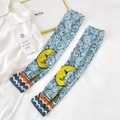 Detail of light blue sun protection arm sleeves with yellow moon and star patterns - One Size / Moon Sailboat