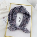 Floral print cotton linen neck scarf with pink and grey patterns tied as a bow - Pink Magnolia Pink