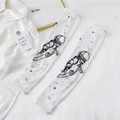 Detail of white ice silk sun sleeves with astronaut and planet space theme prints - One Size / Black and White Astronaut