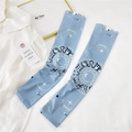 Detailed view of light blue ice silk sun sleeves with zodiac sign prints and hemmed edges - One Size / Zodiac Disc Blue