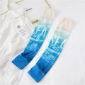 Detail of blue and white gradient sun protection arm sleeves with beach wave print - One Size / SFA Blue Beige