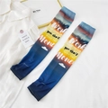 Detail of sunset gradient cooling arm sleeves featuring inspirational slogan print - One Size / Letter Clouds Navy
