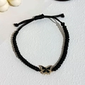 Bracciale in corda intrecciata a mano con ciondolo a farfalla dorata e strass luminosi - Nero (L-033)
