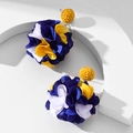Chic fabric flower cluster earrings in blue and yellow on white geometric stand - Yellow flower ball