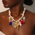 Boho heart and tassel pendant necklace on a model for stylish daily wear - Multi-element Pendant Beige Rope Tassel (X-641)