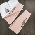 Detail of pink ice silk sunscreen sleeves with printed logo on wooden background - Pink with Black Letter
