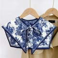Close-up of Toile de Jouy print scarf collar with elegant blue and white tie ribbon - Forest Lion Blue (11F)