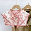 Close-up of a floral print faux collar scarf tied in a bow over a khaki trench coat - Forest Lion Pink (14F)