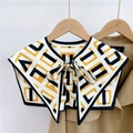 Detail of geometric pattern shawl collar with a decorative bow on a khaki trench coat - Letter Plaid Yellow Black (16F)
