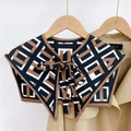 Detail of geometric pattern shawl collar with bow tie on a beige trench coat background - Letter Plaid Camel White (17F)
