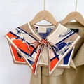 Detail of silk scarf shawl with abstract geometric print and tie closure on a hanger - Colored Stripe Horse Camel (21F)