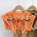 Close-up of vintage orange equestrian print decorative faux collar with a front bow tie knot - Star Chain Orange (24F)