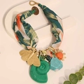 Detail of bohemian scarf necklace featuring golden butterfly and tropical print fabric - Dark Green (X-890)