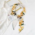 Elegant yellow floral twilly silk scarf for women displayed on a white shirt - 4A Yellow Tulip
