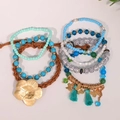 Set de 7 bracelets bohèmes empilables avec perles bleu mer, breloques fleur et papillon or - Ensemble 7 Pièces Gland Fleur Papillon Bleu Mer (S-589)