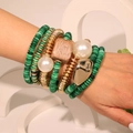 Bohemian 7-piece green acrylic beaded bracelet set with large wood bead and gold charms - Green