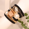 Bohemian stacked bracelet set with black resin disks, gold beads, and white pearls - Black