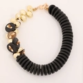Handmade asymmetrical coconut shell necklace with black discs and gold beads - Black/Gold