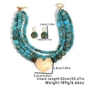 Detail of four-layer bohemian beaded necklace with large gold heart pendant and earrings - Heart Pendant Necklace + Earrings